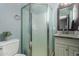 Bathroom with shower stall, toilet and granite countertop vanity at 4628 E Holly St, Phoenix, AZ 85008