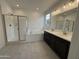 Bathroom with double vanity, soaking tub, and walk-in shower at 5326 W Manzanita Dr, Glendale, AZ 85302