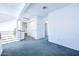 Loft area with carpet, doors to bedrooms and bath at 3907 E Ironwood Dr, Phoenix, AZ 85044