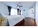 Bedroom with wood flooring and access to a kitchen at 3907 E Ironwood Dr, Phoenix, AZ 85044