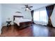 Spacious bedroom with wood flooring and a ceiling fan at 3907 E Ironwood Dr, Phoenix, AZ 85044