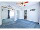 Bedroom with mirrored closet and ceiling fan at 3907 E Ironwood Dr, Phoenix, AZ 85044