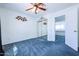 Bright bedroom with ceiling fan and mirrored closet at 3907 E Ironwood Dr, Phoenix, AZ 85044