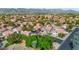 Aerial view of a house in a residential neighborhood with mountain views at 3907 E Ironwood Dr, Phoenix, AZ 85044