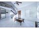 Two-story living room with tile floors and a staircase at 3907 E Ironwood Dr, Phoenix, AZ 85044