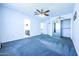 Bright bedroom with ceiling fan and mirrored closet at 3907 E Ironwood Dr, Phoenix, AZ 85044