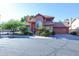 Two-story house with tile roof, attached garage, and lush landscaping at 3907 E Ironwood Dr, Phoenix, AZ 85044