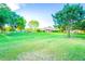 Spacious grassy area, perfect for recreation, with mature trees and a shaded pavilion at 3907 E Ironwood Dr, Phoenix, AZ 85044