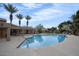 Community pool with palm trees and seating at 3907 E Ironwood Dr, Phoenix, AZ 85044