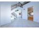 Bright living room with tile floors and staircase to upper level at 3907 E Ironwood Dr, Phoenix, AZ 85044