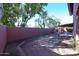 Landscaped backyard with brick border and mature trees at 3907 E Ironwood Dr, Phoenix, AZ 85044