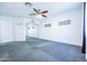 Spacious bedroom with ceiling fan and mirrored closet at 3907 E Ironwood Dr, Phoenix, AZ 85044