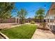 Landscaped backyard with artificial turf and patio at 2901 N Miller Rd, Scottsdale, AZ 85251