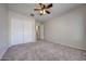 Bedroom with double door closet and carpet flooring at 3998 N 294Th Ln, Buckeye, AZ 85396