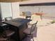 Outdoor kitchen and patio furniture create an inviting space for entertaining at 13443 W Crocus Dr, Surprise, AZ 85379