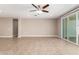 Living room with sliding glass doors and tile floors at 37784 W San Sisto Ave, Maricopa, AZ 85138