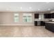 Open dining area with tile floors and kitchen access at 37784 W San Sisto Ave, Maricopa, AZ 85138