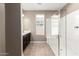 Bathroom with large walk-in shower and tiled floor at 37784 W San Sisto Ave, Maricopa, AZ 85138