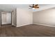 Spacious bedroom with ceiling fan and carpeted floor at 37784 W San Sisto Ave, Maricopa, AZ 85138