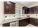 Kitchen sink and dishwasher with granite countertops at 37784 W San Sisto Ave, Maricopa, AZ 85138