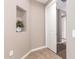 Small hallway with built-in shelving and a door at 37784 W San Sisto Ave, Maricopa, AZ 85138