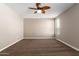 Bright bedroom with ceiling fan and carpet flooring at 37784 W San Sisto Ave, Maricopa, AZ 85138