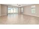 Bright living room featuring tile floors and ceiling fan at 37784 W San Sisto Ave, Maricopa, AZ 85138