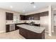 Spacious kitchen featuring granite island and stainless steel appliances at 37784 W San Sisto Ave, Maricopa, AZ 85138