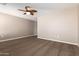 Bedroom with ceiling fan and neutral wall colors at 37784 W San Sisto Ave, Maricopa, AZ 85138
