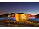 Dramatic water feature at night with landscape lighting at 6850 E Joshua Tree Ln, Paradise Valley, AZ 85253