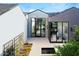 Private courtyard with glass doors and a water feature at 6850 E Joshua Tree Ln, Paradise Valley, AZ 85253