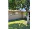 Landscaped backyard with a large tree at 10509 W Tropicana Cir, Sun City, AZ 85351