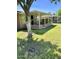 Covered patio with grassy backyard and block wall at 10509 W Tropicana Cir, Sun City, AZ 85351