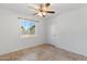 Bright bedroom with tile flooring and ceiling fan at 18001 N 43Rd Way, Phoenix, AZ 85032