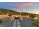 Fire pit with seating at dusk, mountain views at 2449 W Sunrise Dr, Phoenix, AZ 85041