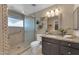 Updated bathroom with granite countertop and walk-in shower at 2449 W Sunrise Dr, Phoenix, AZ 85041