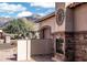 Outdoor fireplace and patio area with mountain views at 10683 E Saddle Blanket Trl, Gold Canyon, AZ 85118