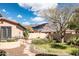 Landscaped backyard with mountain views and stone path at 10683 E Saddle Blanket Trl, Gold Canyon, AZ 85118