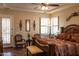Main bedroom with king-size bed, and access to backyard patio at 10683 E Saddle Blanket Trl, Gold Canyon, AZ 85118