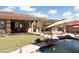 Spacious backyard oasis with covered patio and pool at 10683 E Saddle Blanket Trl, Gold Canyon, AZ 85118
