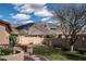 Landscaped backyard with mountain views and a stone patio at 10683 E Saddle Blanket Trl, Gold Canyon, AZ 85118