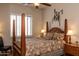 Guest bedroom with a post bed, and a rustic southwestern style at 10683 E Saddle Blanket Trl, Gold Canyon, AZ 85118
