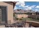 Backyard patio with seating area and mountain views at 10683 E Saddle Blanket Trl, Gold Canyon, AZ 85118