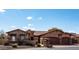 Two-story house with three-car garage and desert landscaping at 10683 E Saddle Blanket Trl, Gold Canyon, AZ 85118