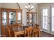 Bright dining room with wood table and chairs, and built-in hutch at 10683 E Saddle Blanket Trl, Gold Canyon, AZ 85118