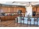 Spacious kitchen with dark wood cabinets and granite countertops at 10683 E Saddle Blanket Trl, Gold Canyon, AZ 85118