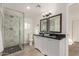 Bathroom with walk-in shower, double vanity, and granite countertop at 721 W 3Rd Pl, Mesa, AZ 85201