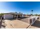 Updated home with a gravel driveway and white fence at 721 W 3Rd Pl, Mesa, AZ 85201