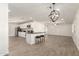 Modern kitchen featuring white cabinets and an island at 721 W 3Rd Pl, Mesa, AZ 85201