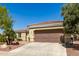 Single-story home with a two-car garage and desert landscaping at 13846 W Figueroa Dr, Sun City West, AZ 85375